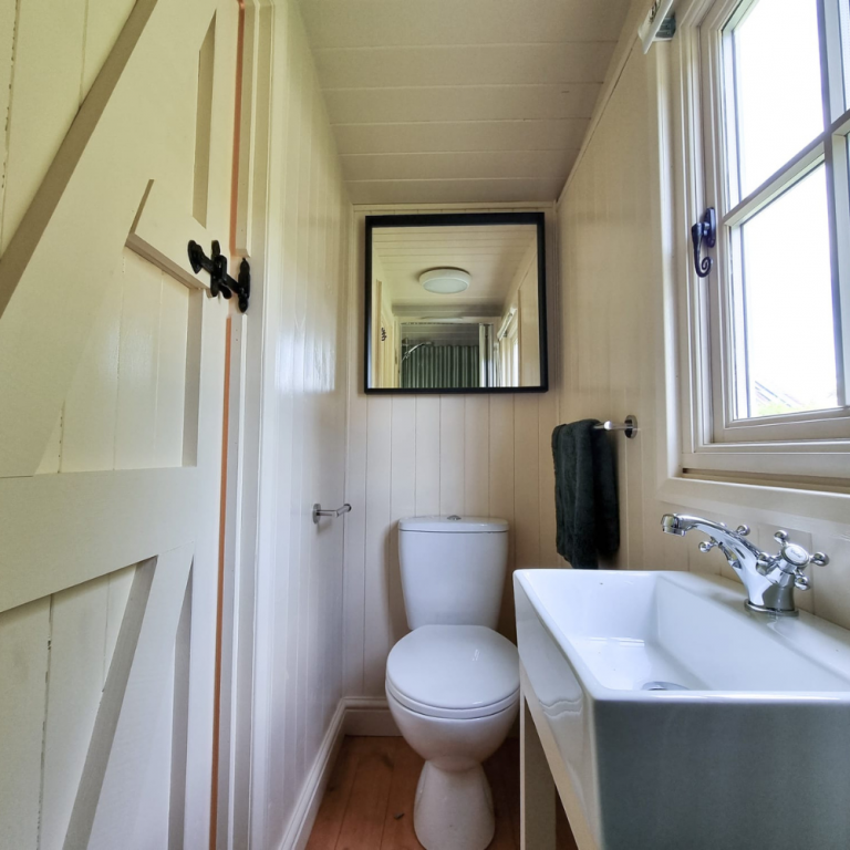 ShepherdsHutwithselfcontainedbathroomwithtoilet sinkandshower 768x768